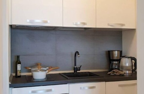 Susello Apartment | Attractive studio with terrace, garden, air conditioning, pool and dream lake view
