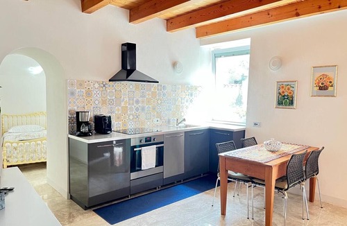 Naggio Apartment | 'Crooked House' Apartment with Mountain View, Private Garden and Parking