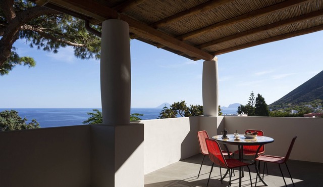 Apartment with spacious terrace overlooking the sea in a villa with swimming pool and garden